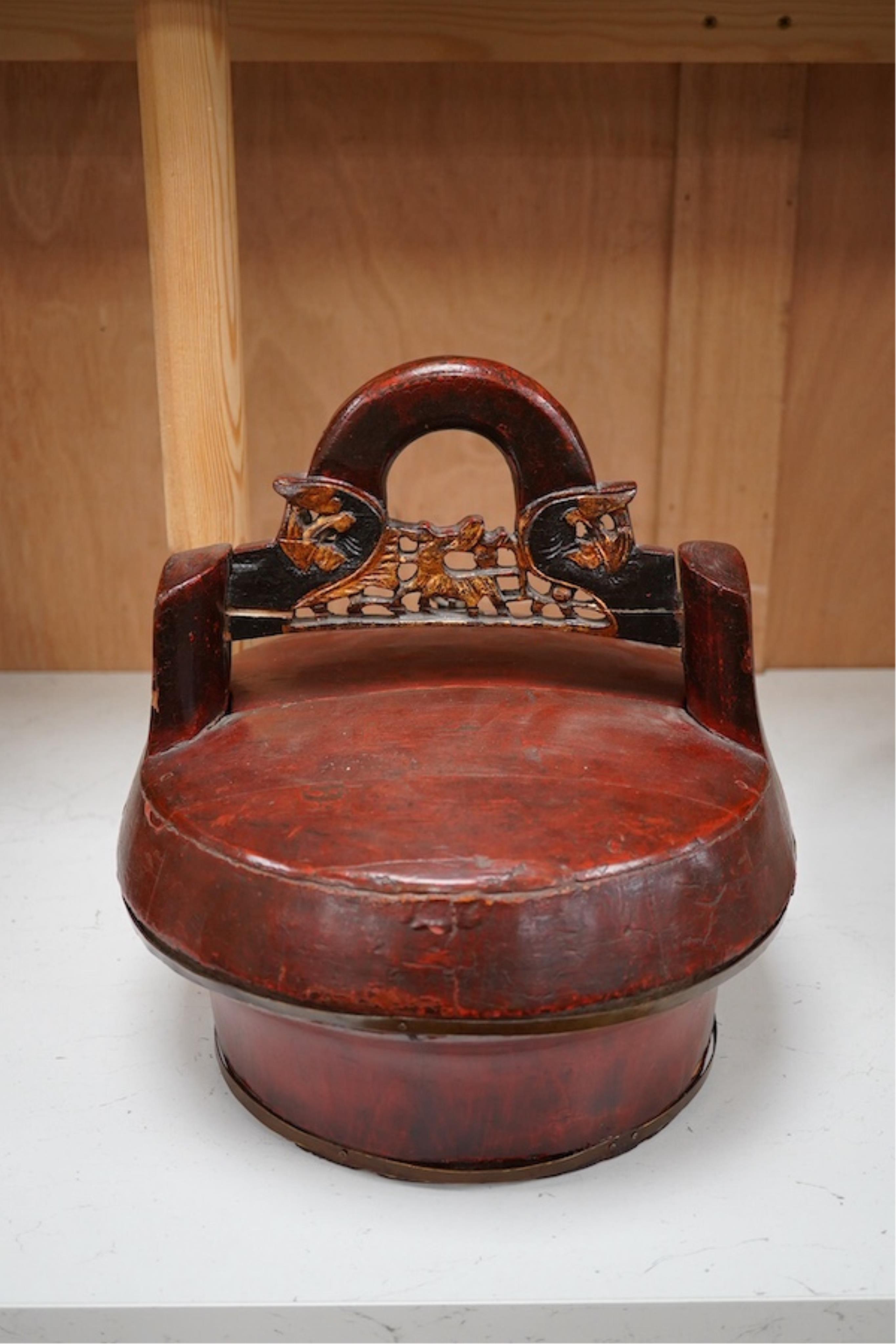 A Chinese red stained and carved food box, 29.5cm high. Condition - fair